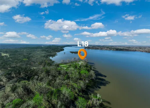 a view of a lake with a yard