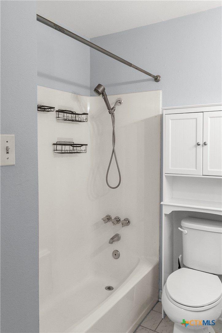 204 Berwick Road Victoria, TX 77904 - Photo 18 of 38 a bathroom with a toilet and a shower