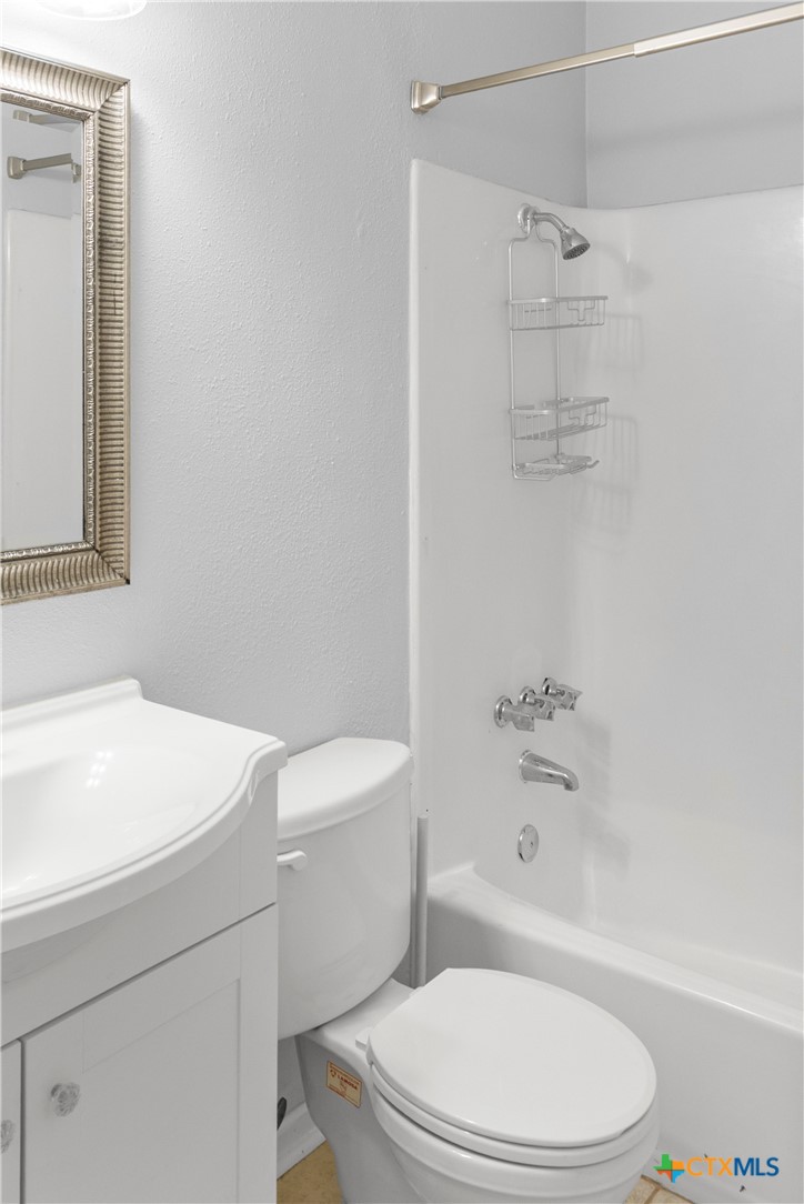 204 Berwick Road Victoria, TX 77904 - Photo 20 of 38 a white toilet and a shower curtain