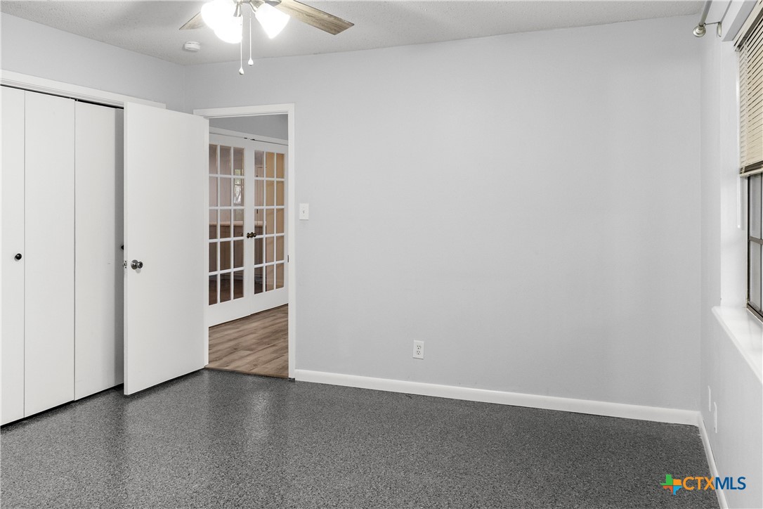 204 Berwick Road Victoria, TX 77904 - Photo 21 of 38 an empty room with wooden floor closet and windows