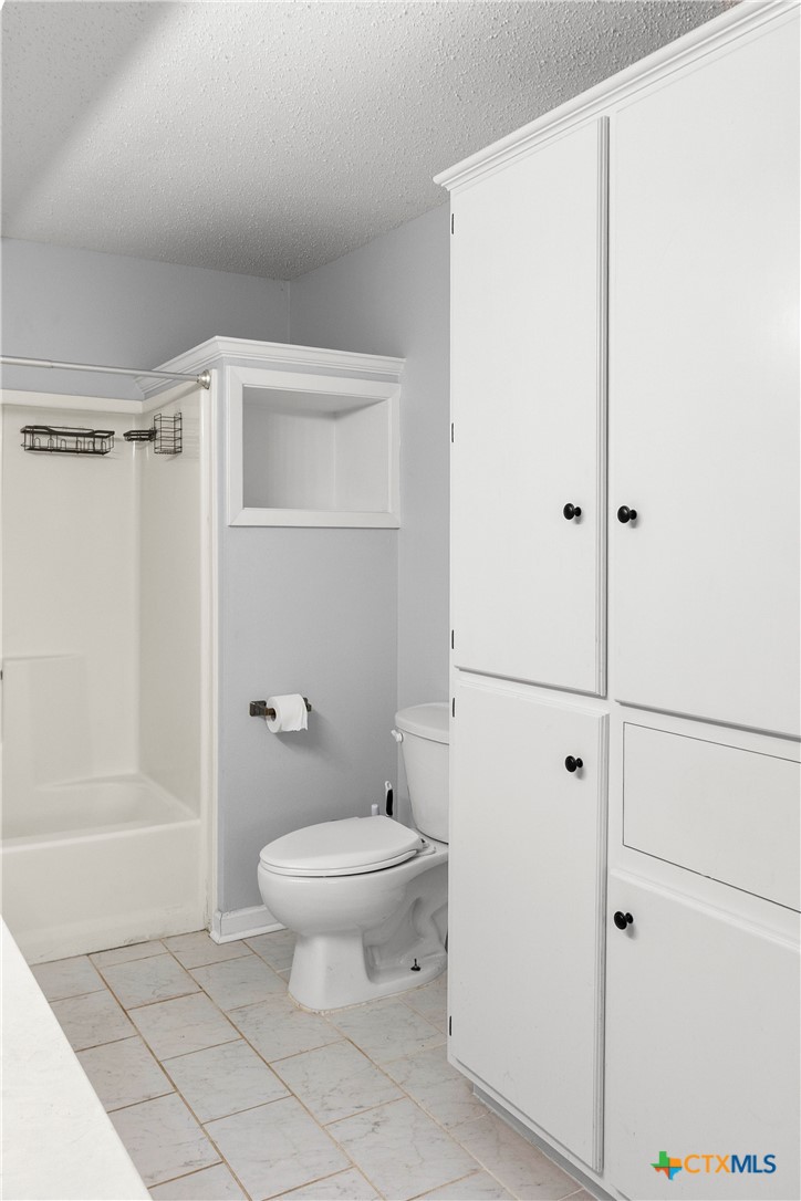 204 Berwick Road Victoria, TX 77904 - Photo 25 of 38 a bathroom with a toilet and a shower