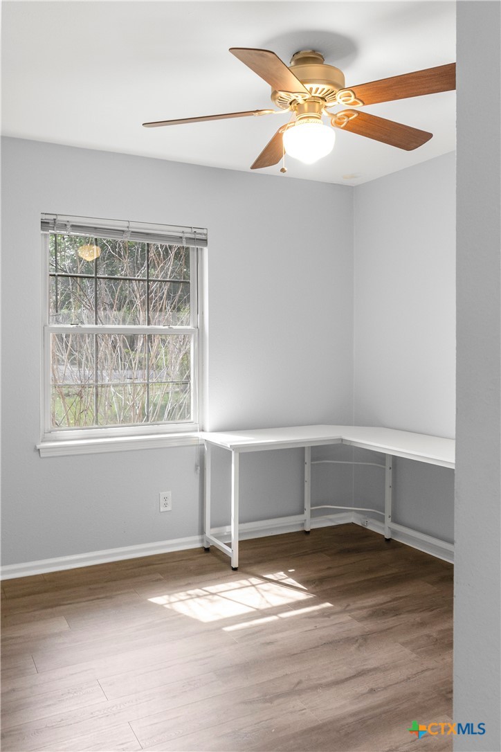 204 Berwick Road Victoria, TX 77904 - Photo 27 of 38 a view of an empty room with wooden floor and a window