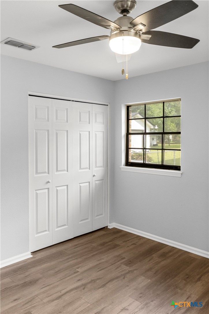204 Berwick Road Victoria, TX 77904 - Photo 29 of 38 a view of an empty room with a window and wooden floor