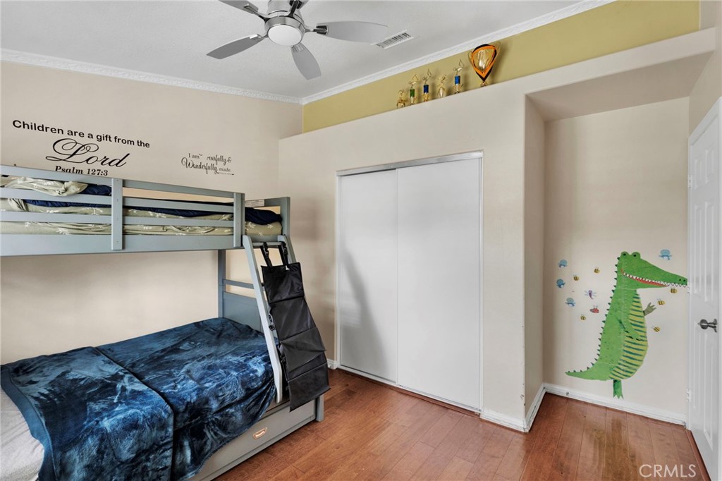 17777 Brazier Drive Riverside, CA 92508 - Photo 29 of 55 a bedroom with a bed and a chandelier