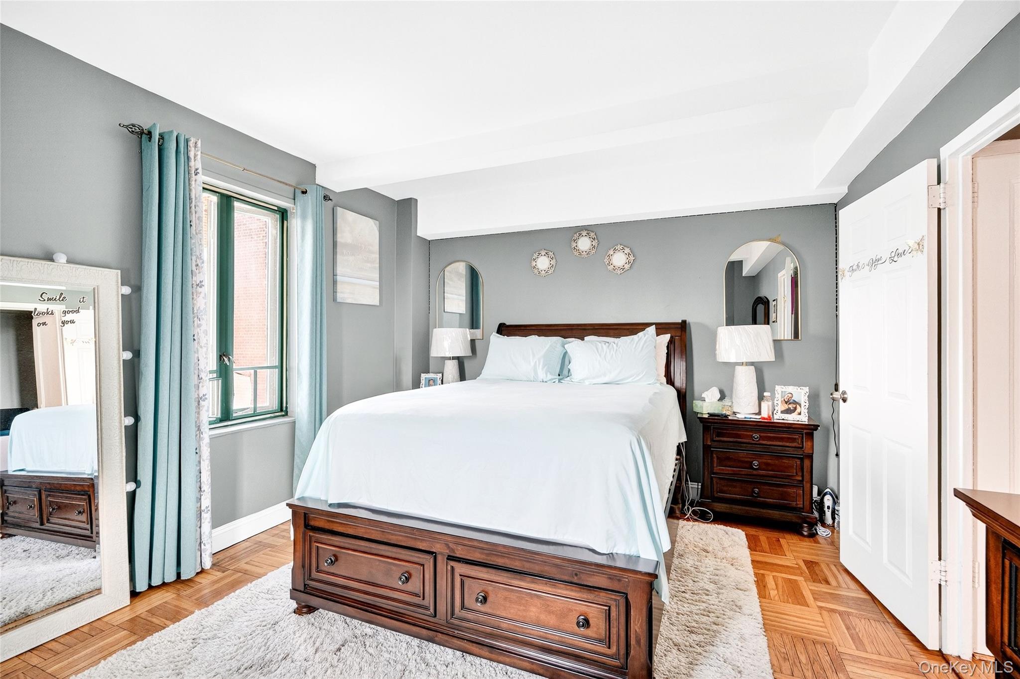 1314 Virginia Avenue, Unit 6G Bronx, NY 10462 - Photo 17 of 34 a bedroom with a bed and wooden floor