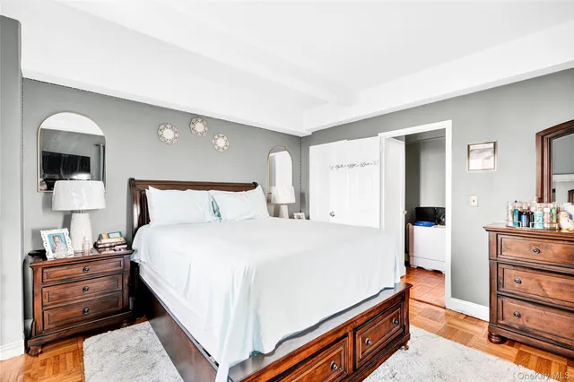 a bedroom with a bed and a dresser