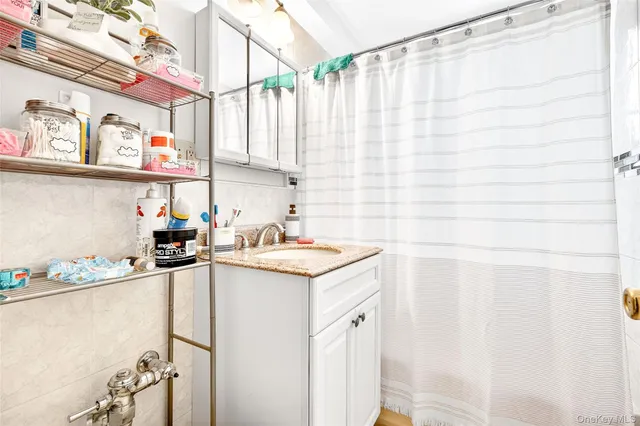 a kitchen with stainless steel appliances a sink a stove and a refrigerator