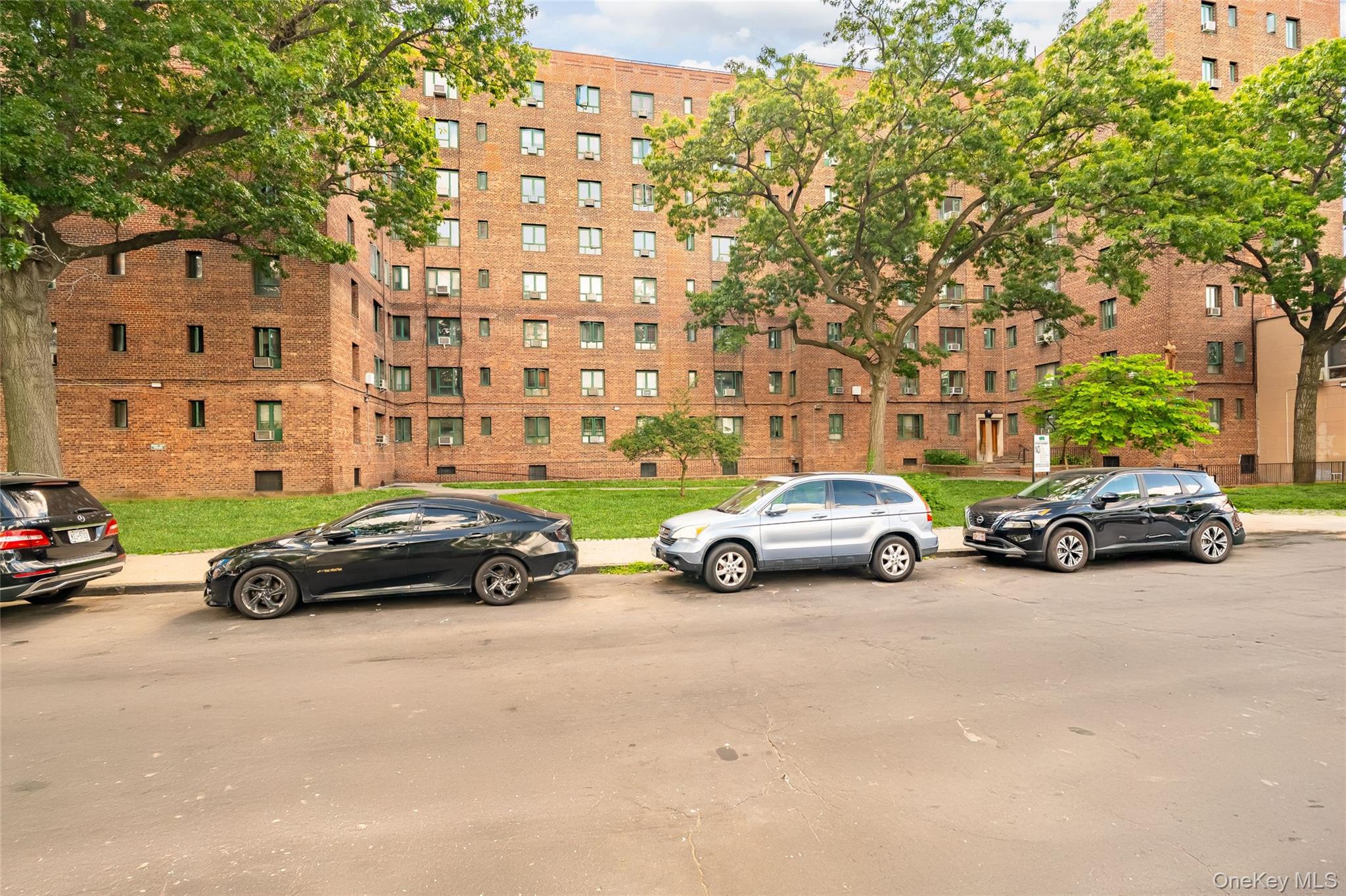 1314 Virginia Avenue, Unit 6G Bronx, NY 10462 - Photo 24 of 34 a view of a cars parked in front of a building