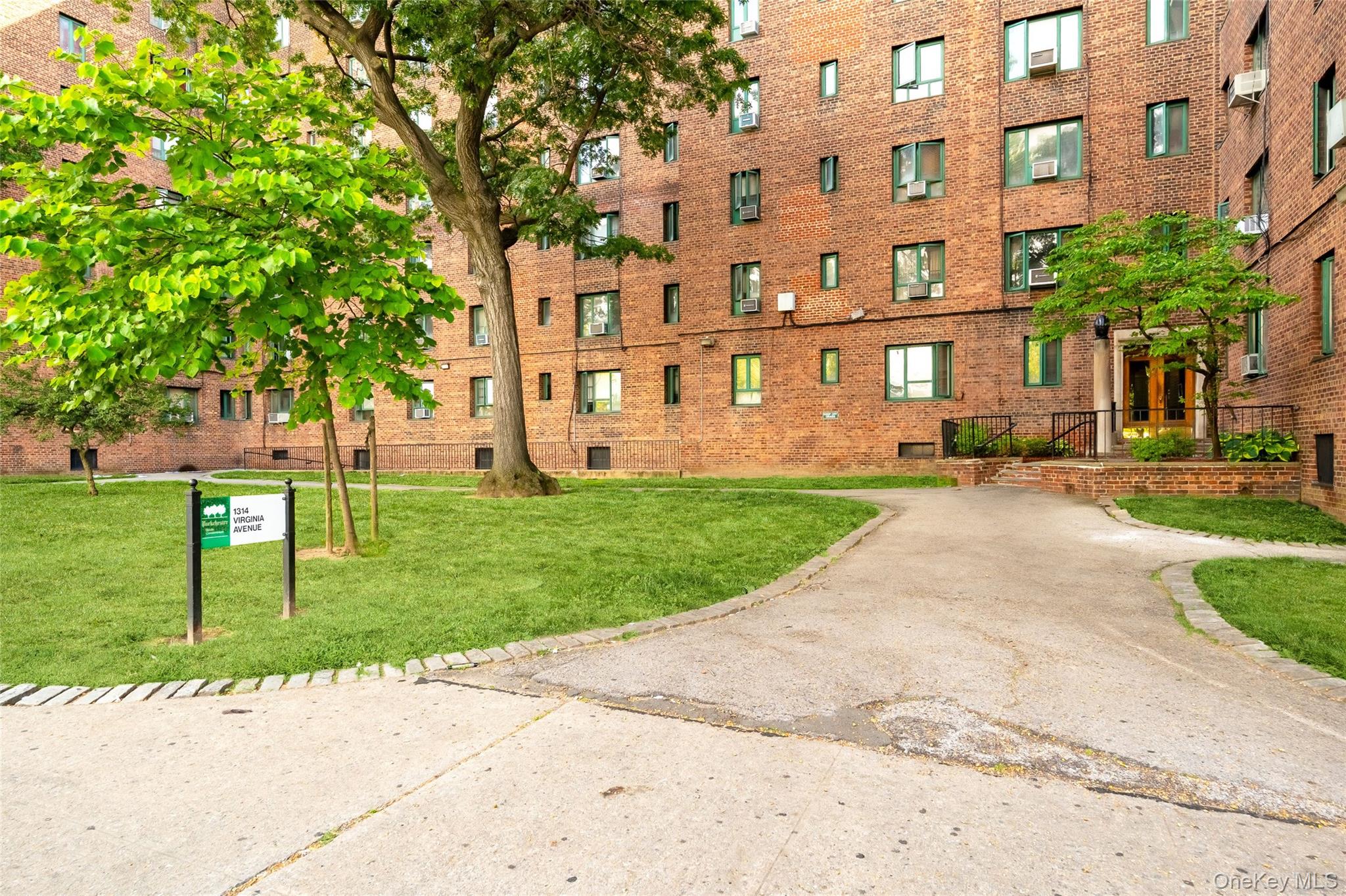 1314 Virginia Avenue, Unit 6G Bronx, NY 10462 - Photo 27 of 34 a view of a building with a yard