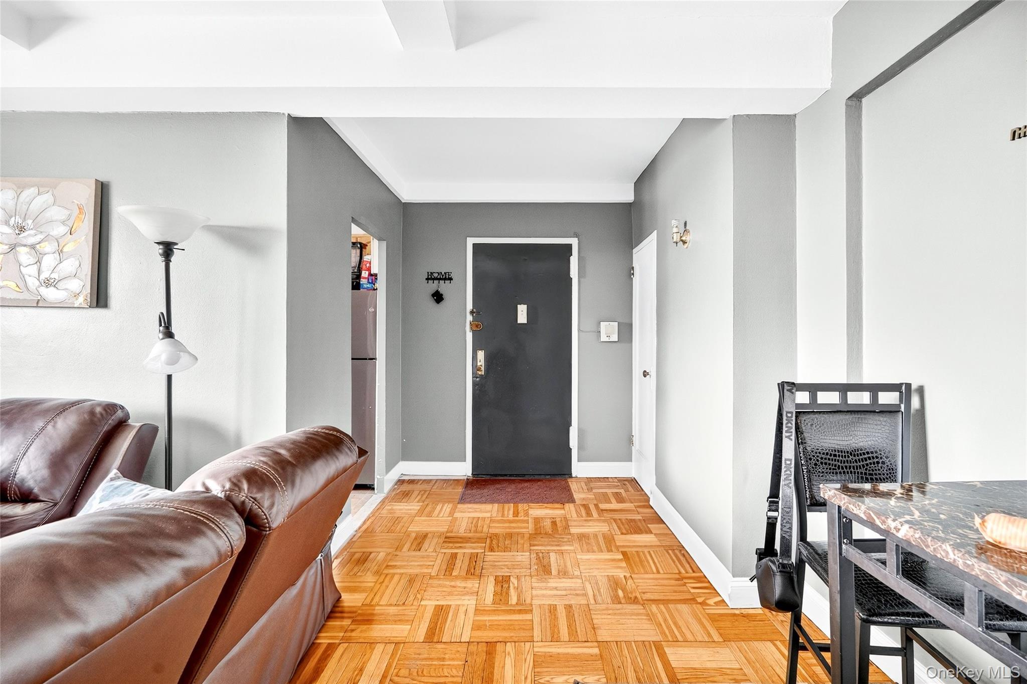 1314 Virginia Avenue, Unit 6G Bronx, NY 10462 - Photo 6 of 34 a living room with furniture and a rug