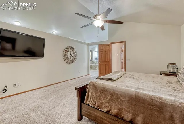 a bathroom with a granite countertop sink a toilet a mirror and shower
