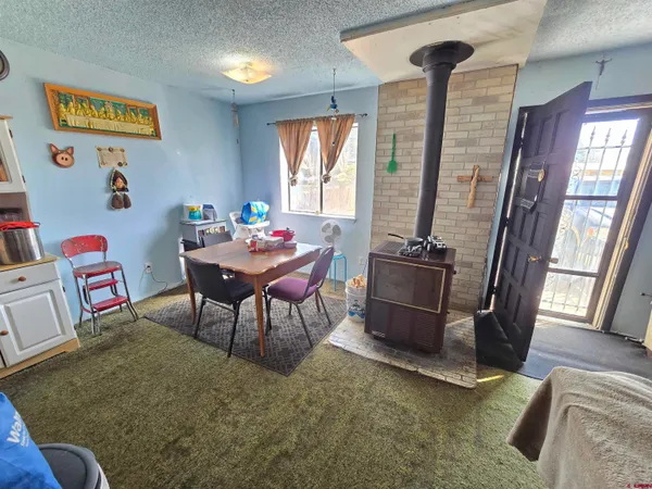 a work room with furniture and a window