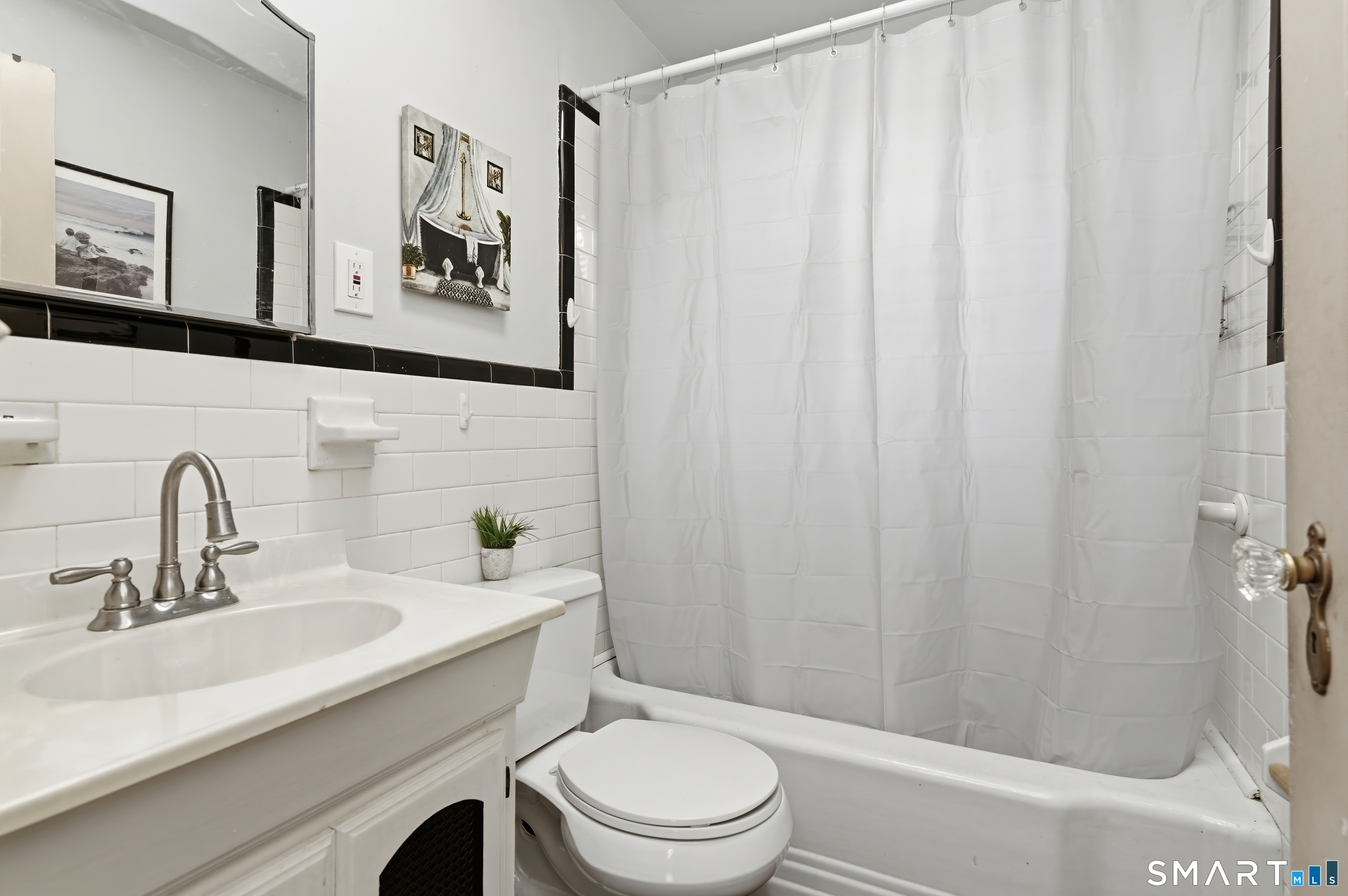 170 Hillside Avenue Bridgeport, CT 06604 - Photo 12 of 35 a bathroom with a sink a toilet and shower