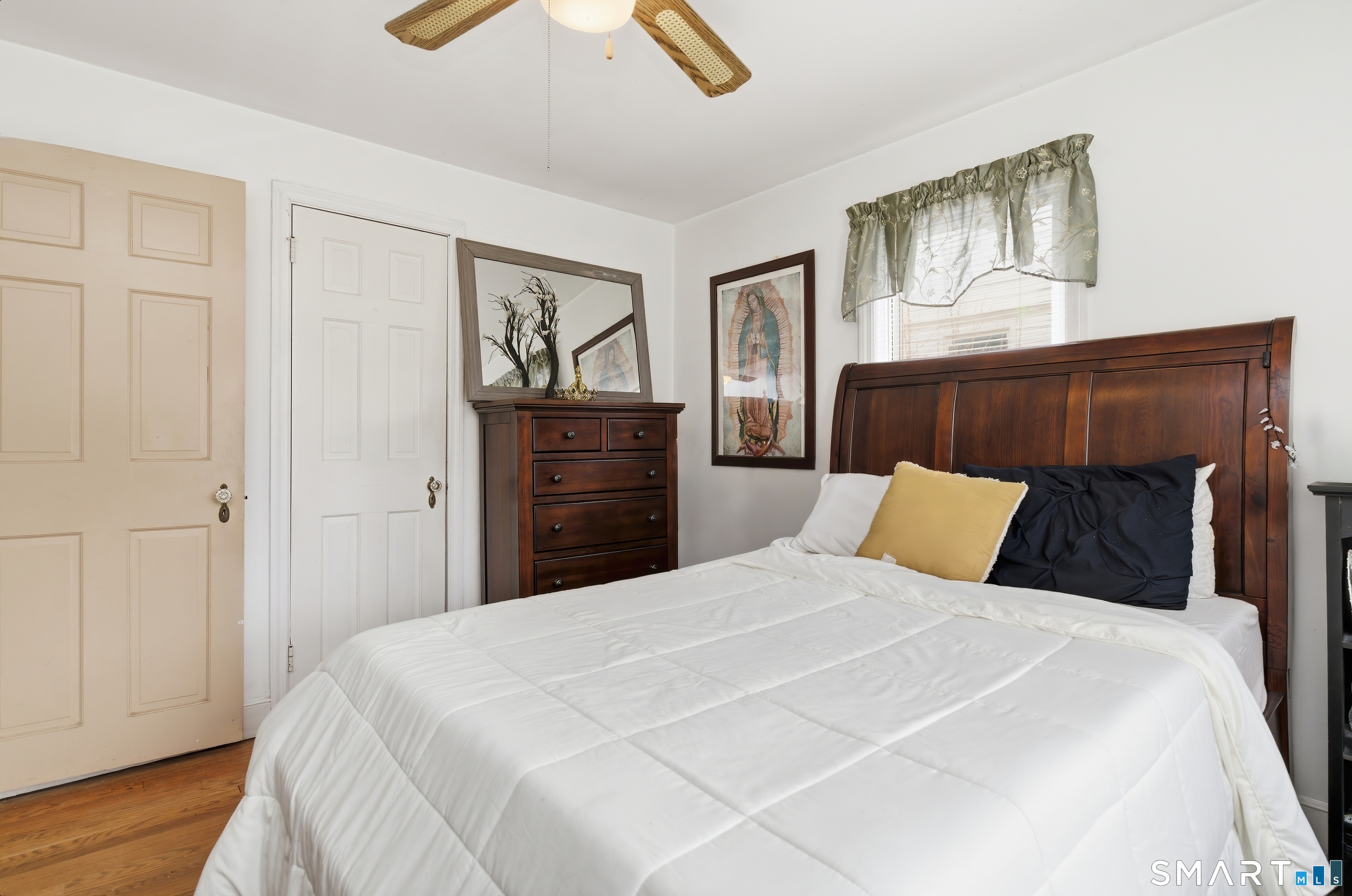 170 Hillside Avenue Bridgeport, CT 06604 - Photo 15 of 35 a bed room with a bed and a painting