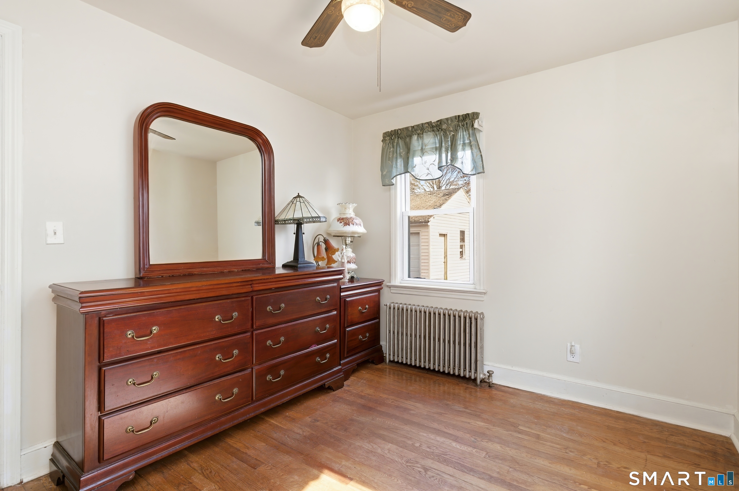 170 Hillside Avenue Bridgeport, CT 06604 - Photo 19 of 35 a room with a dresser and a window