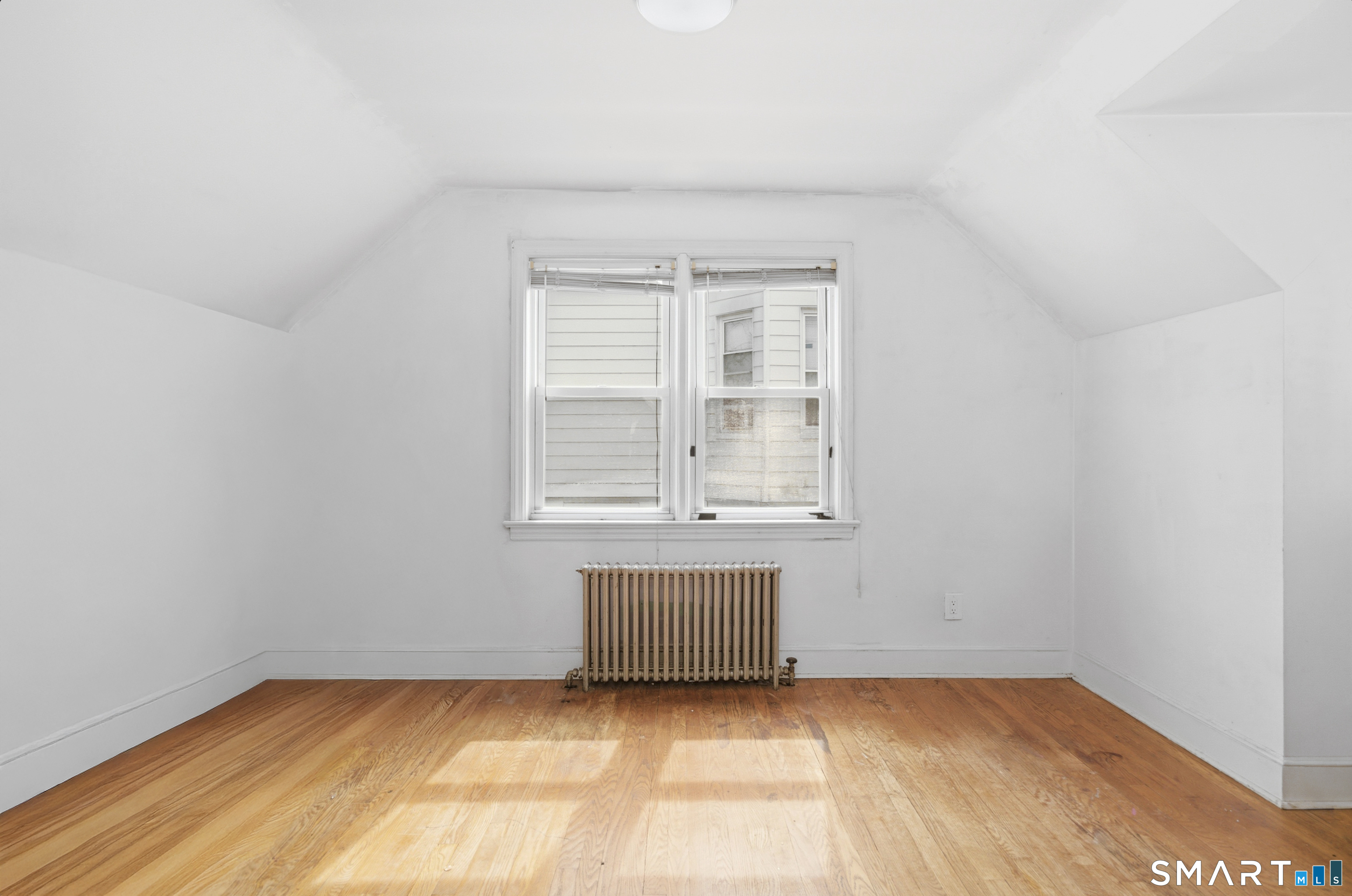 170 Hillside Avenue Bridgeport, CT 06604 - Photo 21 of 35 a view of an empty room with a window