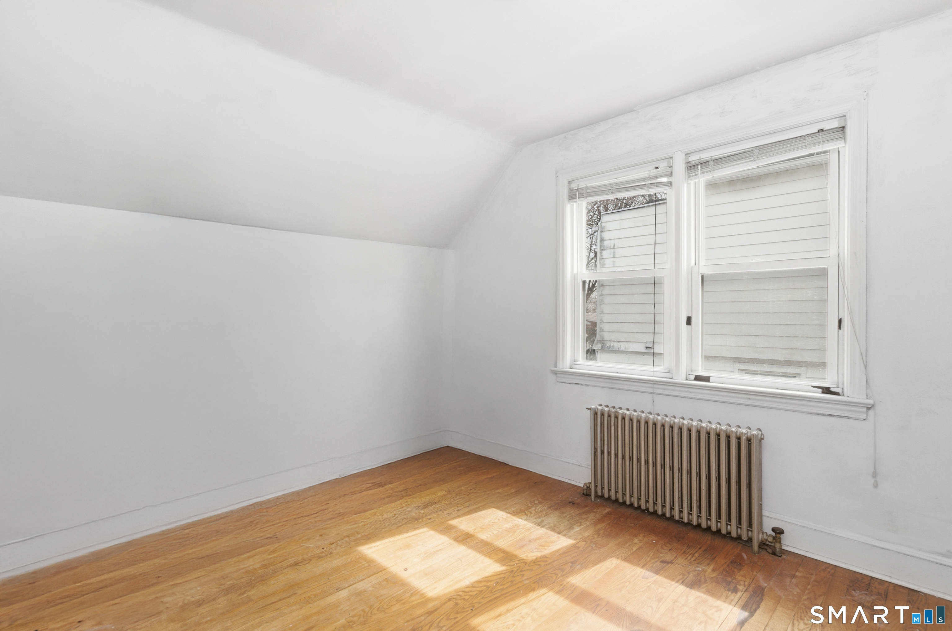 170 Hillside Avenue Bridgeport, CT 06604 - Photo 22 of 35 an empty room with a window