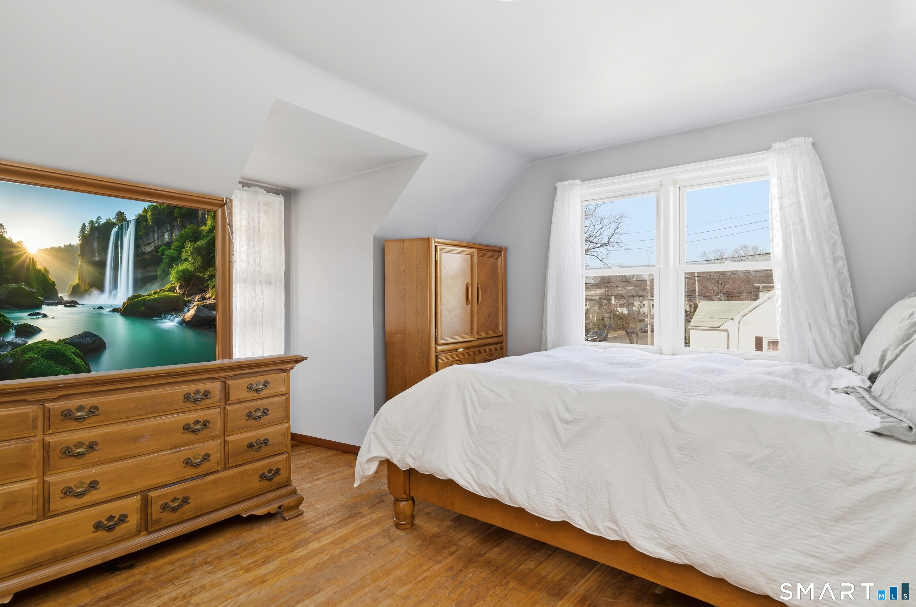 170 Hillside Avenue Bridgeport, CT 06604 - Photo 24 of 35 a bedroom with a bed and a dresser