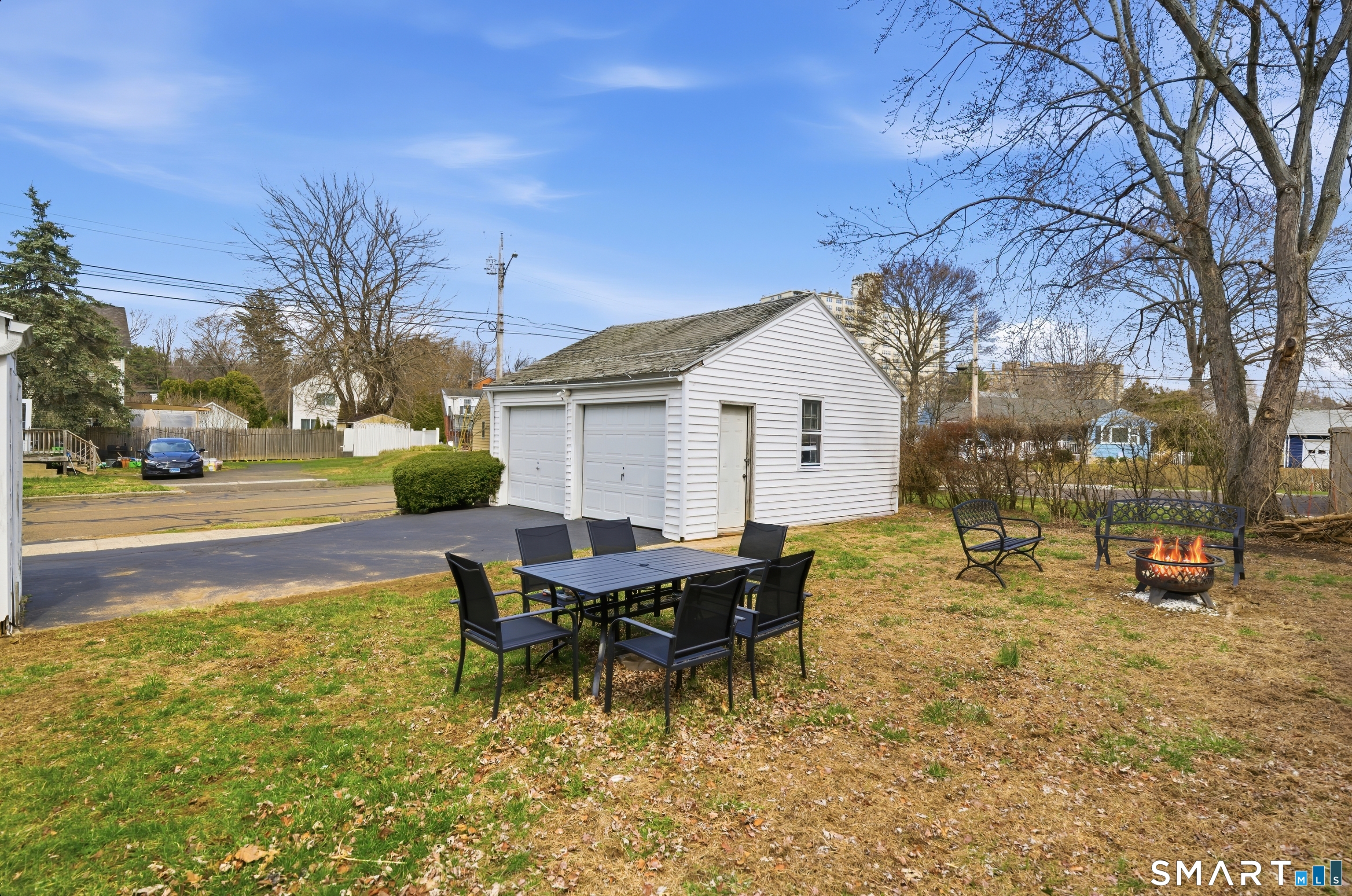170 Hillside Avenue Bridgeport, CT 06604 - Photo 30 of 35 a backyard of a house with barbeque oven table and chairs