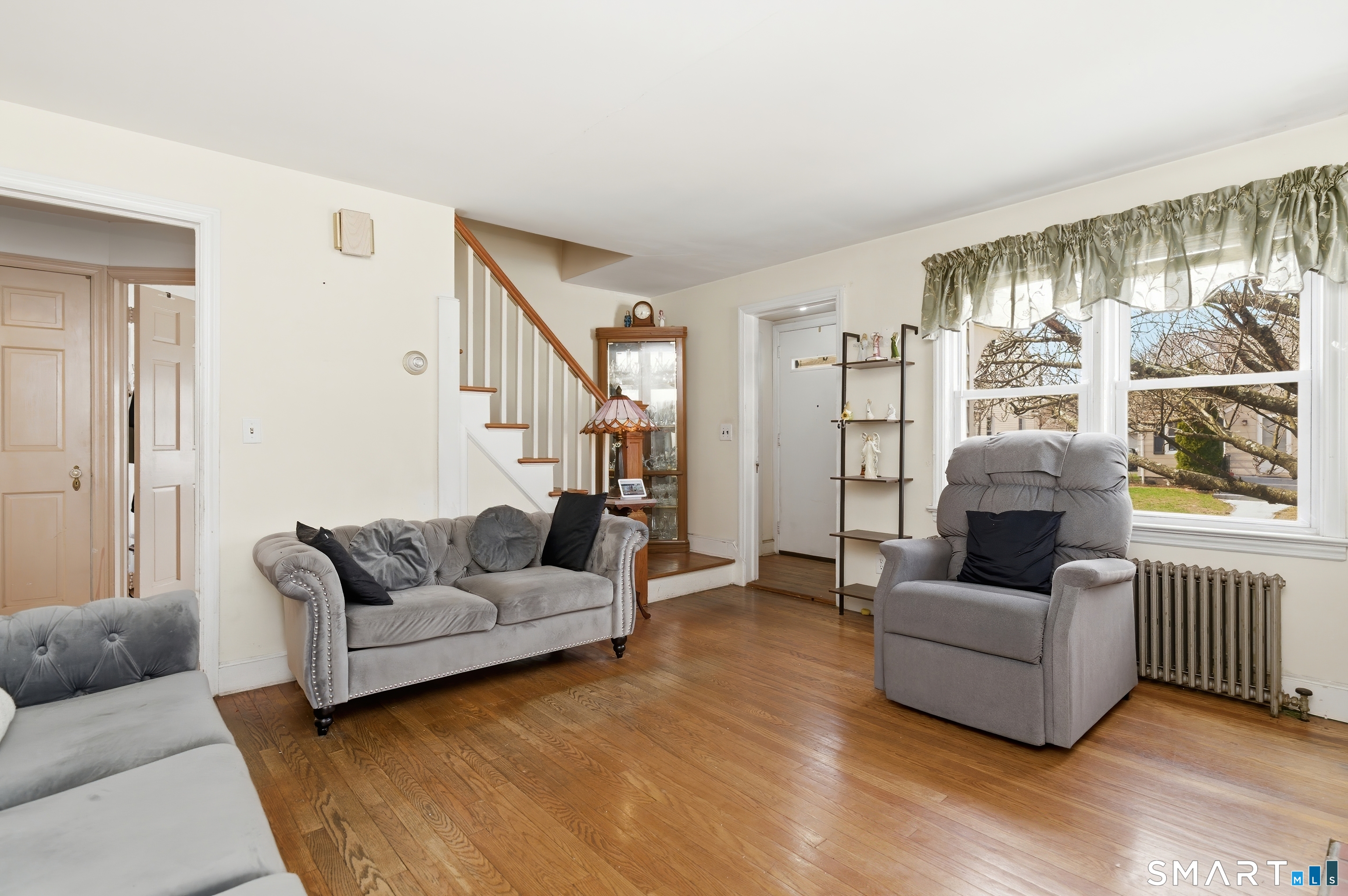170 Hillside Avenue Bridgeport, CT 06604 - Photo 4 of 35 a living room with furniture and a large window