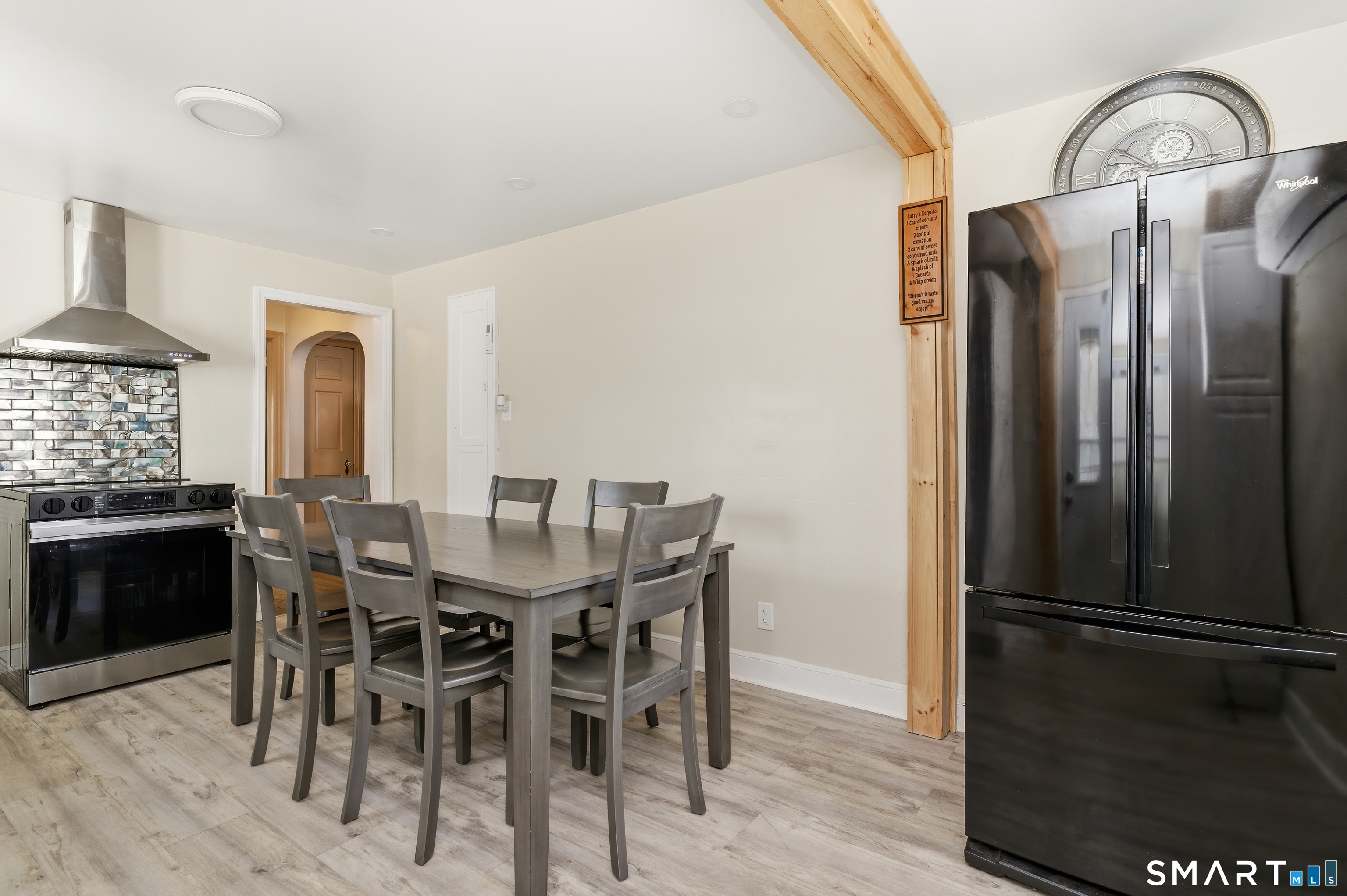 170 Hillside Avenue Bridgeport, CT 06604 - Photo 9 of 35 a view of a dining room with furniture window and wooden floor