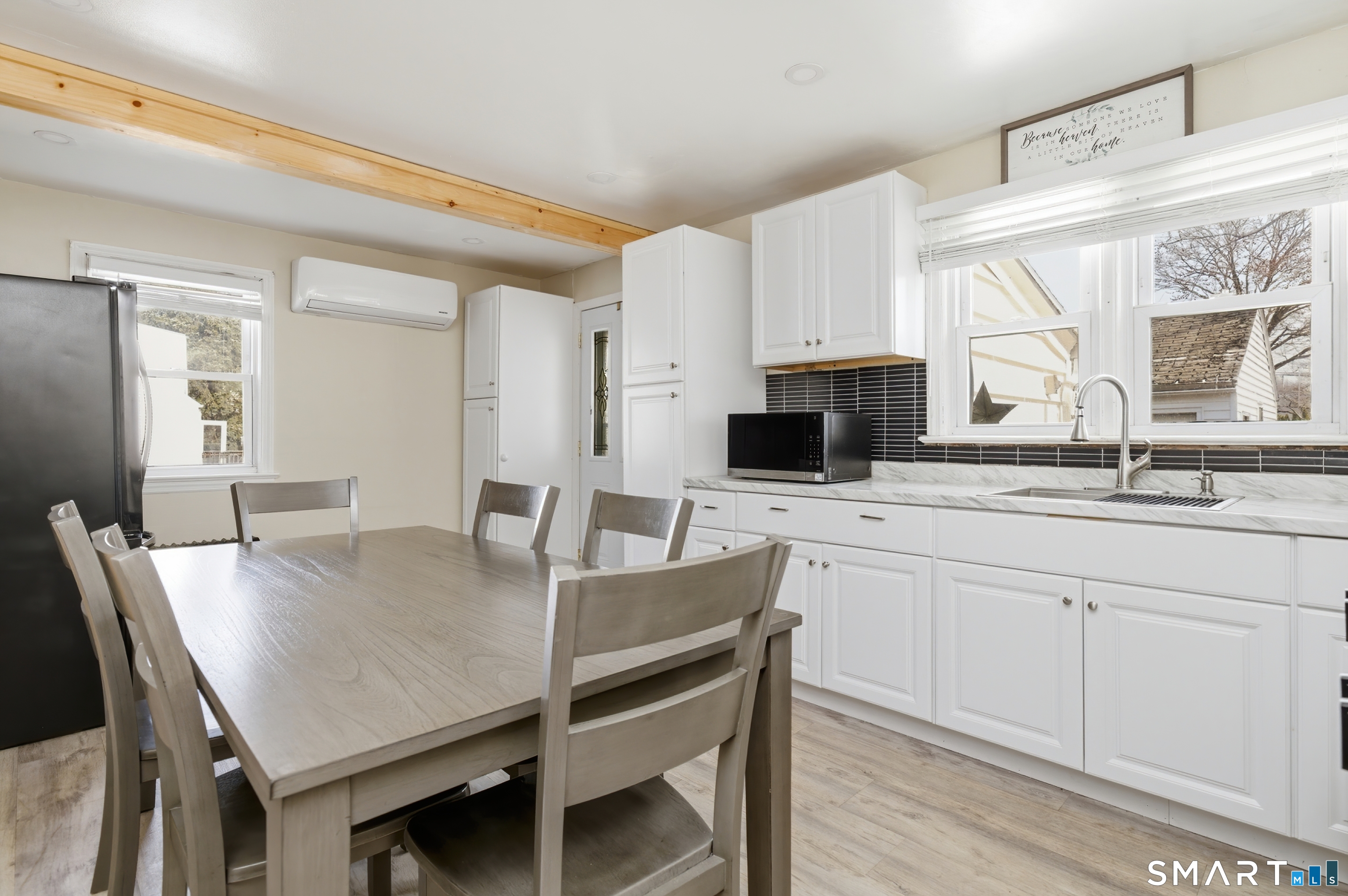 170 Hillside Avenue Bridgeport, CT 06604 - Photo 10 of 35 a kitchen with stainless steel appliances granite countertop a dining table chairs and granite counter tops