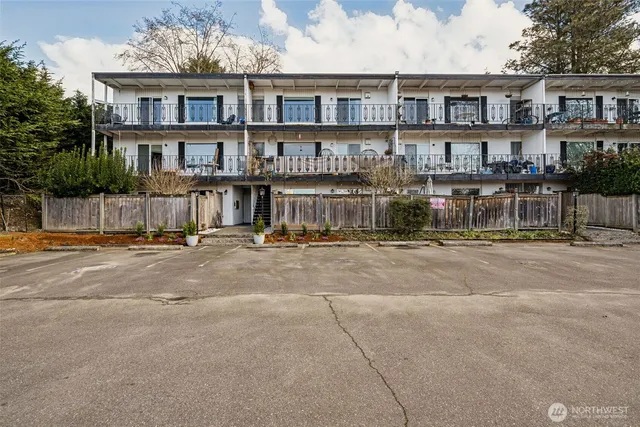 a view of a brick building next to a road