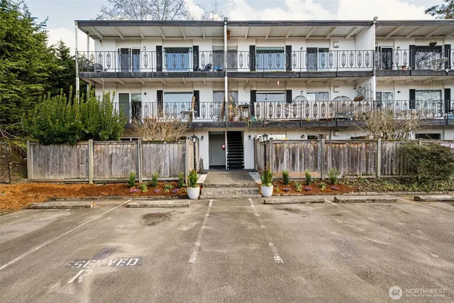 a view of a brick building with many windows