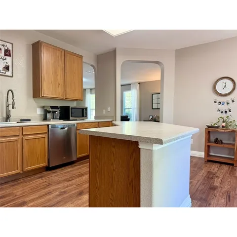 a bathroom with a sink toilet and mirror