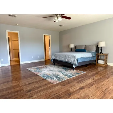 a bathroom with a sink a toilet and a shower