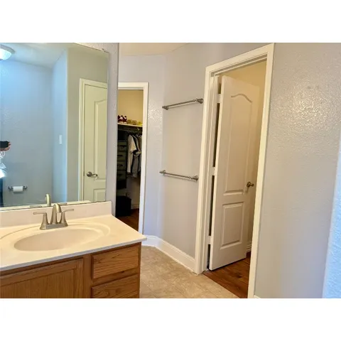 a bathroom with a sink a tub and a shower