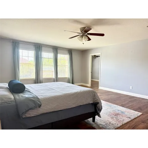 a room with window and ceiling fan