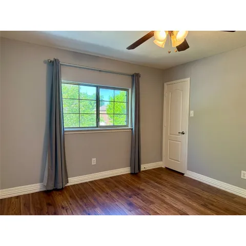 a bathroom with a sink a toilet a shower and a mirror