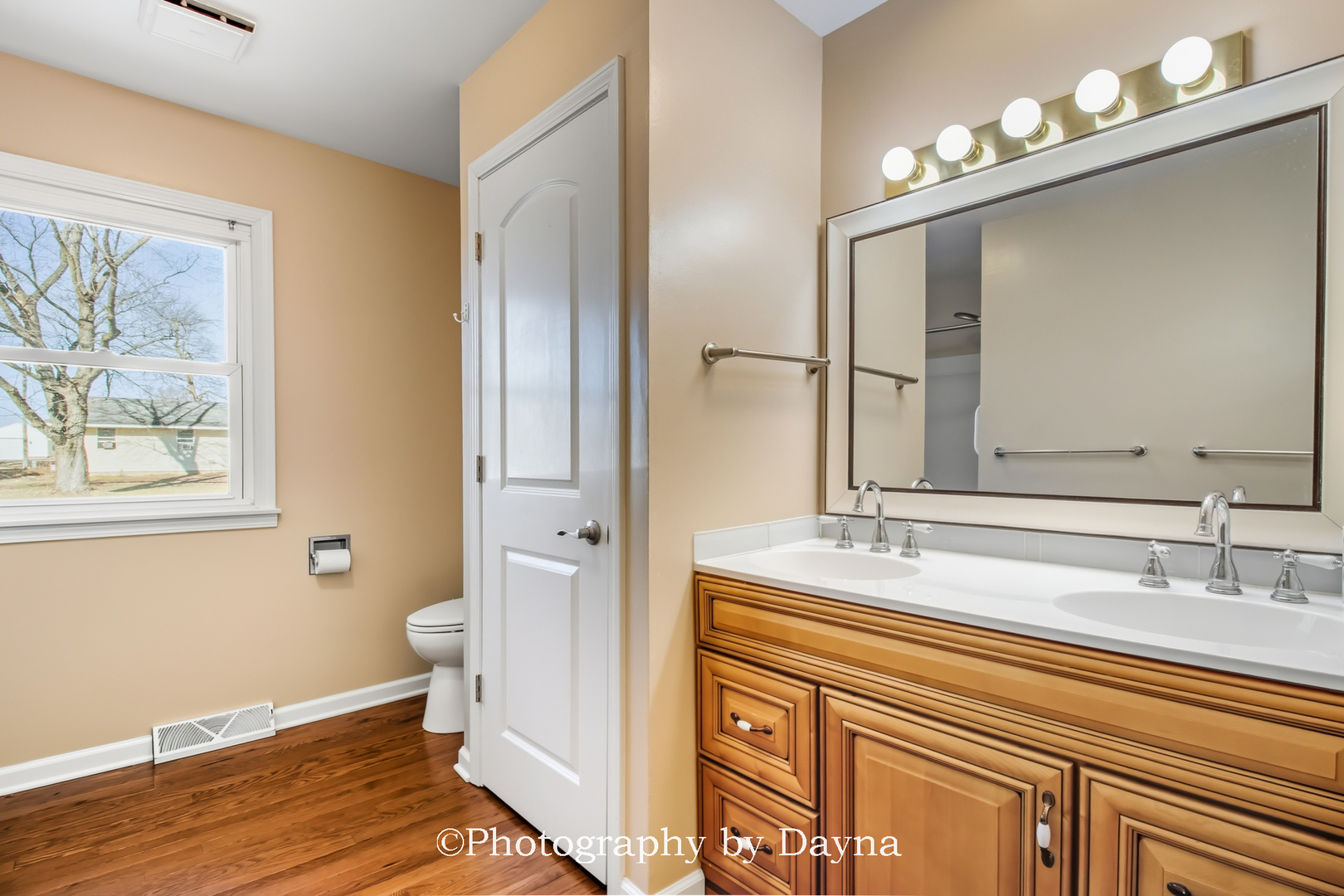 711 Sycamore Street Watseka, IL 60970 - Photo 14 of 21 a bathroom with a sink a toilet and a mirror
