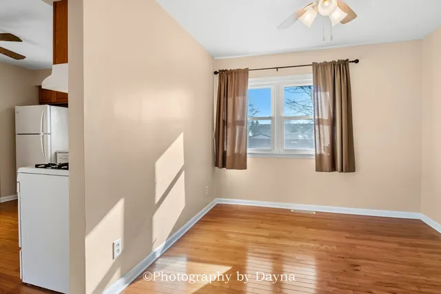a view of an entryway with wooden floor and a window