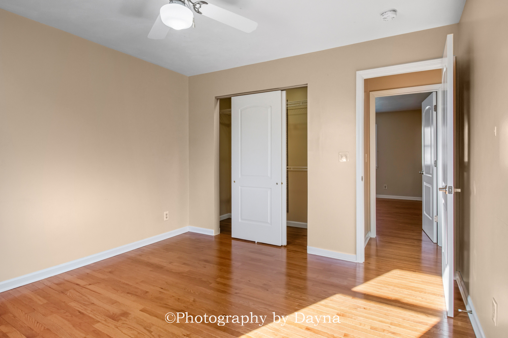711 Sycamore Street Watseka, IL 60970 - Photo 9 of 21 an empty room with wooden floor and closet