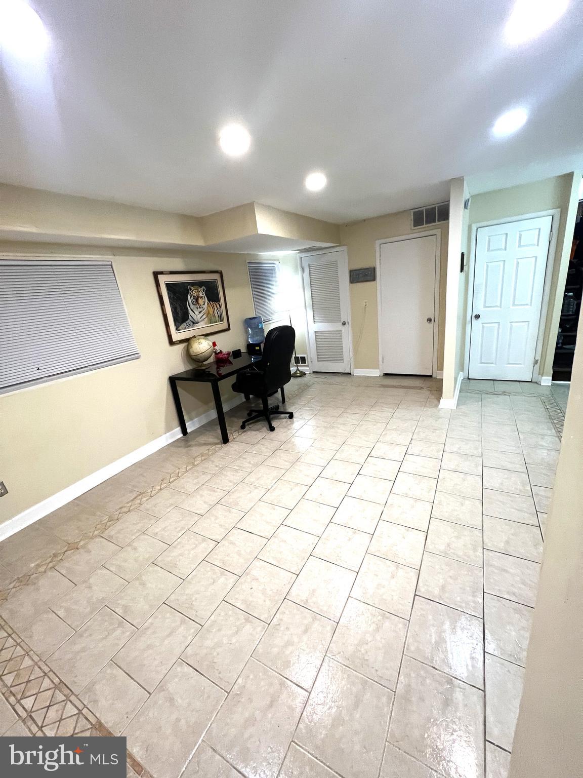 11321 College View Drive Silver Spring, MD 20902 - Photo 14 of 75 Recessed lighting brightens this large room.