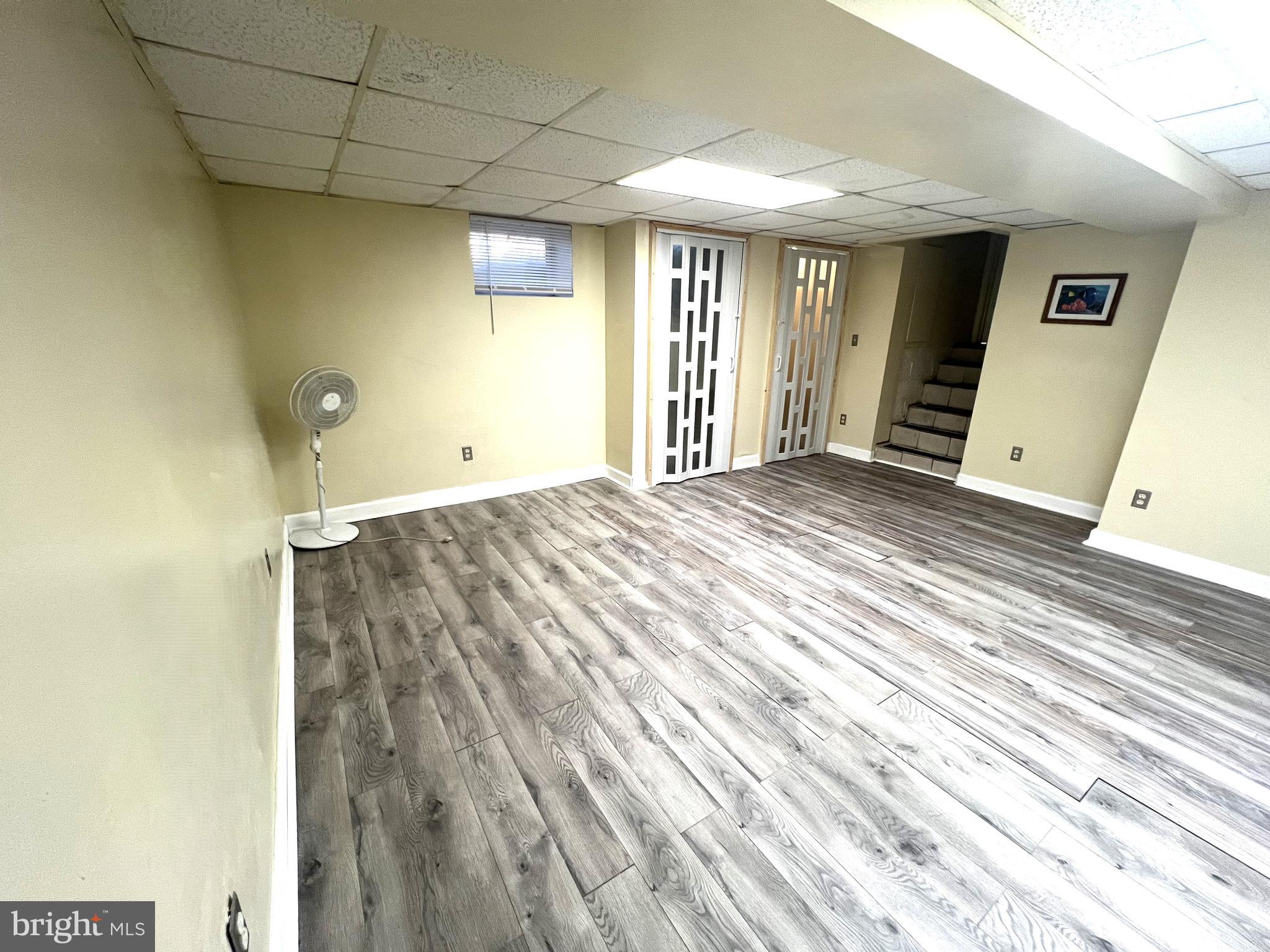 11321 College View Drive Silver Spring, MD 20902 - Photo 16 of 75 a view of a livingroom with wooden floor and stairs