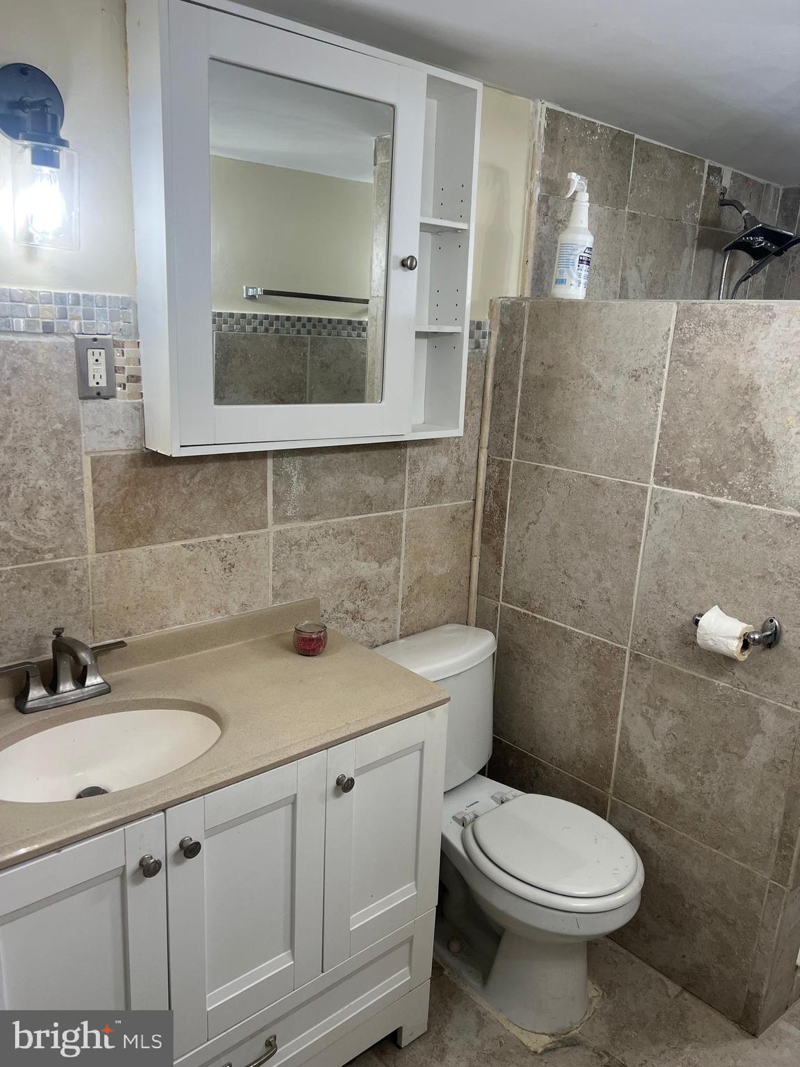 11321 College View Drive Silver Spring, MD 20902 - Photo 23 of 75 a bathroom with a sink a toilet and mirror