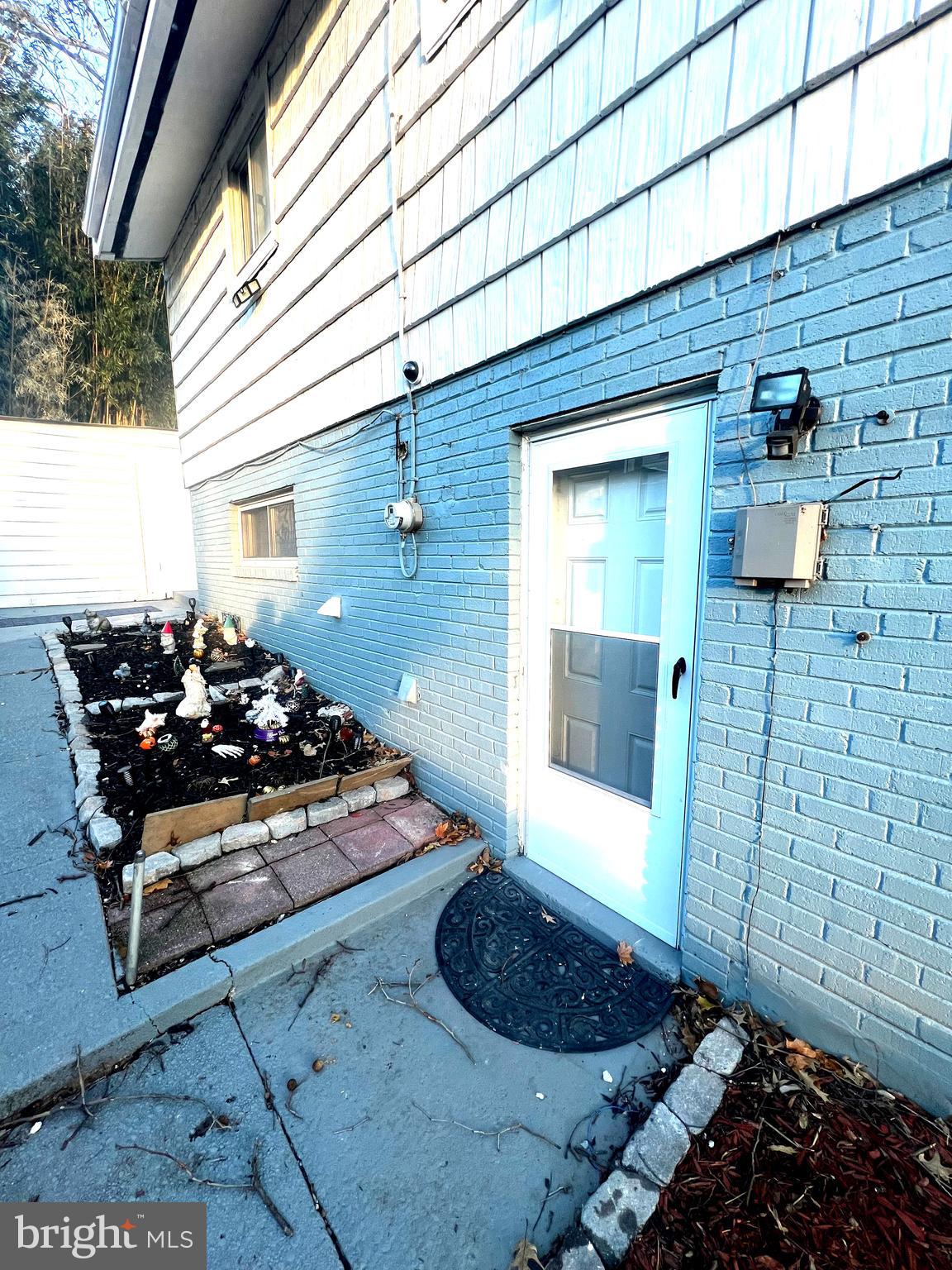 11321 College View Drive Silver Spring, MD 20902 - Photo 50 of 75 a couple of blue chairs sitting in front of a door