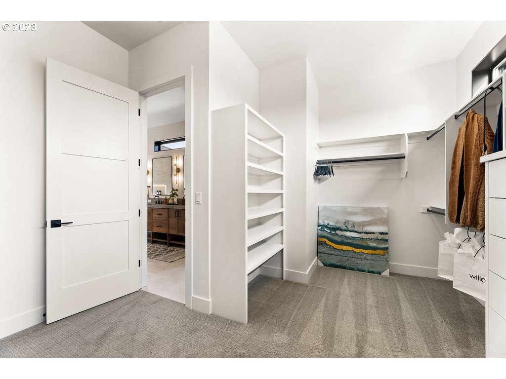 2127 South 19th Way Ridgefield, WA 98642 - Photo 5 of 25 a view of walk in closet with clothes and shoes