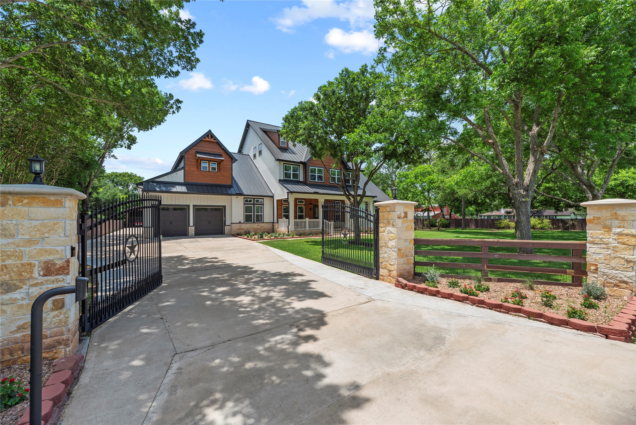 4607 Clayhead Road Richmond, TX 77406 - Photo 2 of 49 Behind automatic private gates, this extraordinary custom estate blends timeless architecture with elevated luxury on a sprawling homesite.