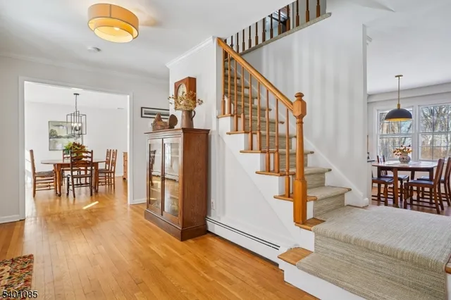 a living room with furniture a lamp and a window