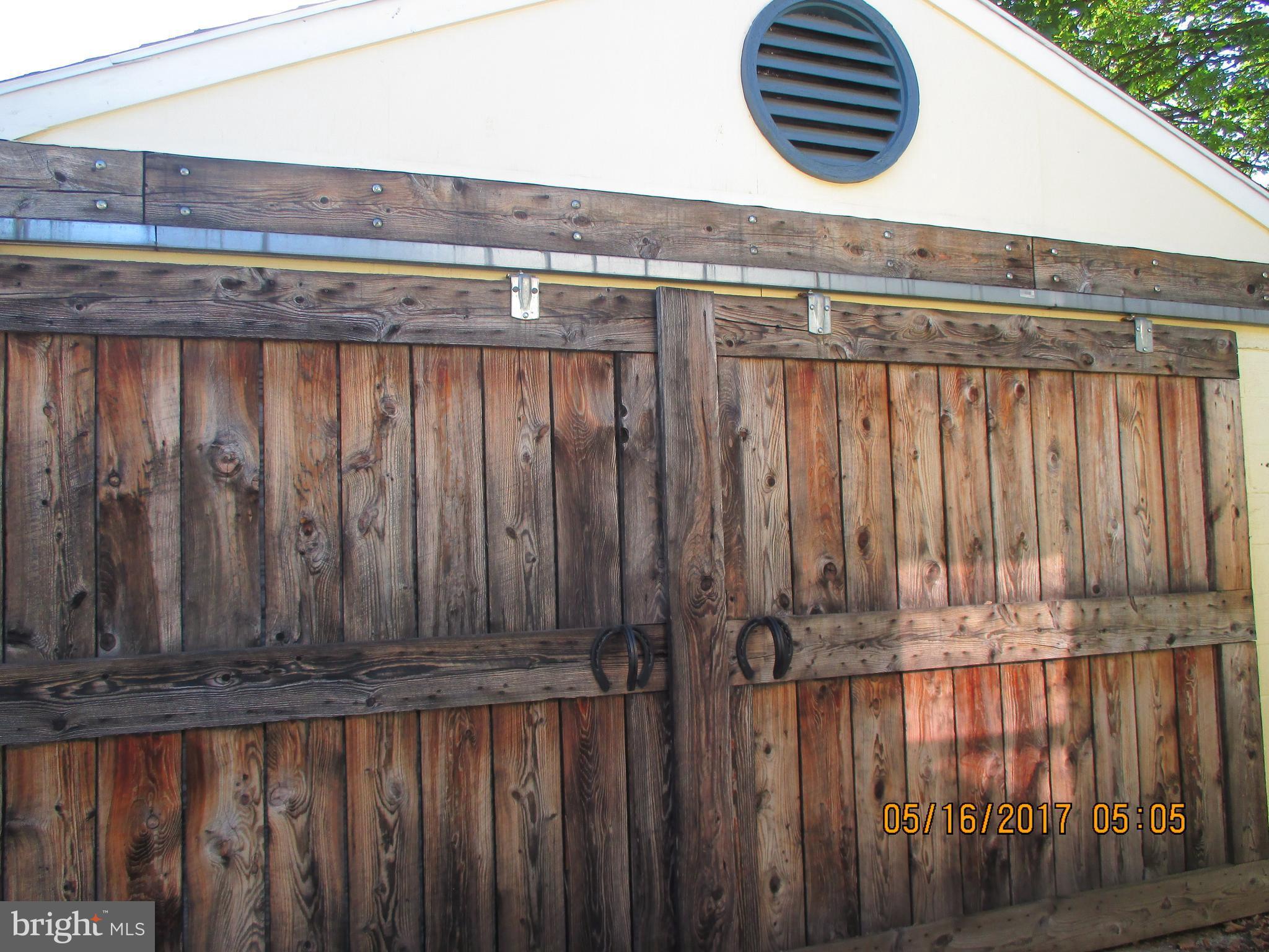 11232 Hollywood Road Hagerstown, MD 21740 - Photo 21 of 26 Barn door style on garage with horse shoe handles