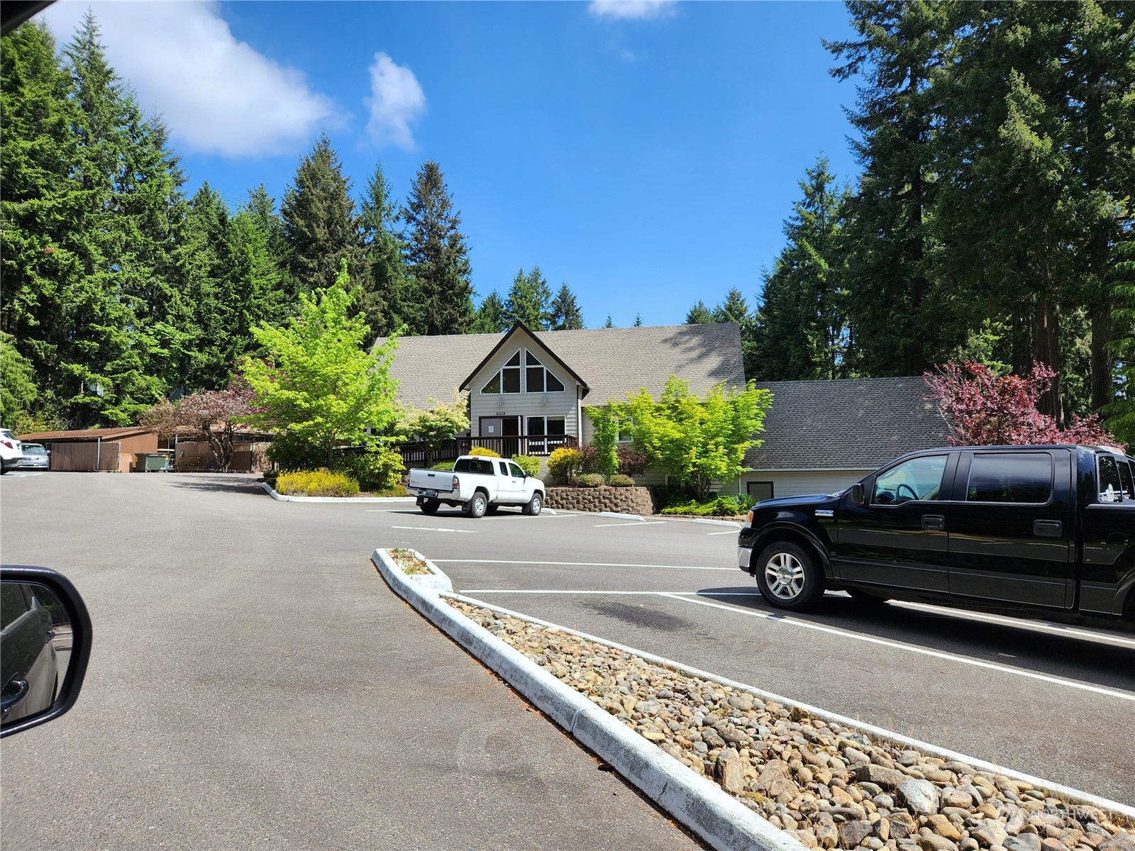 12506 Yoman Road Anderson Island, WA 98303 - Photo 11 of 11 a car parked on the side of the road