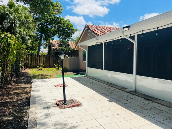 a house view with a backyard space
