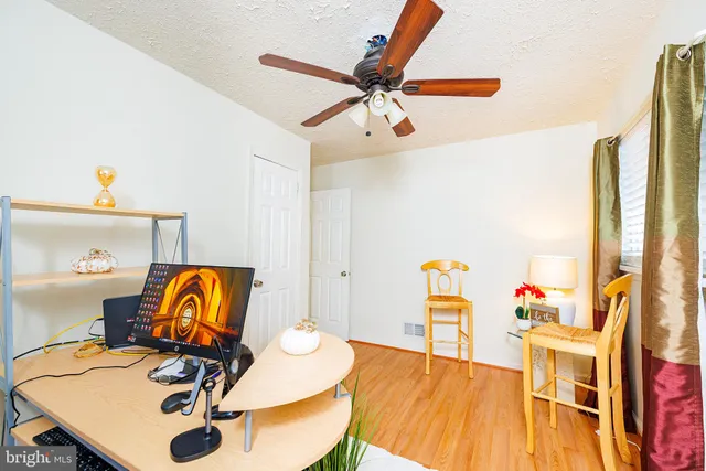 a view of a workspace with furniture