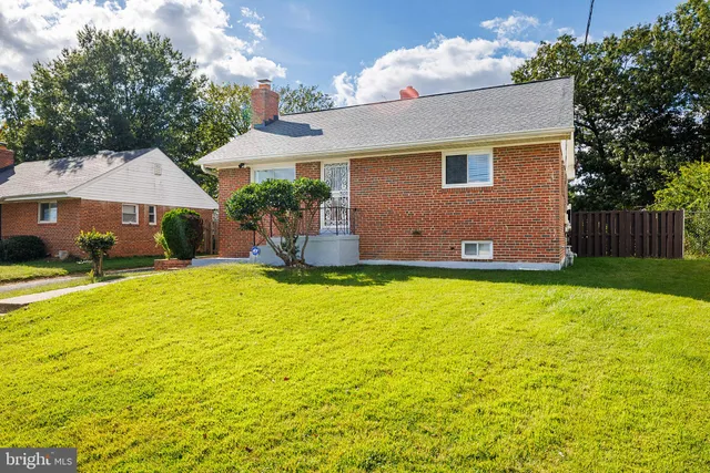 a front view of a house with yard and garage