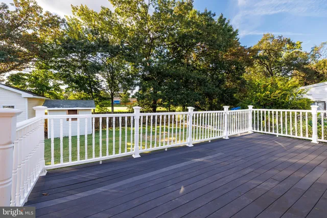a front view of house with yard and trees