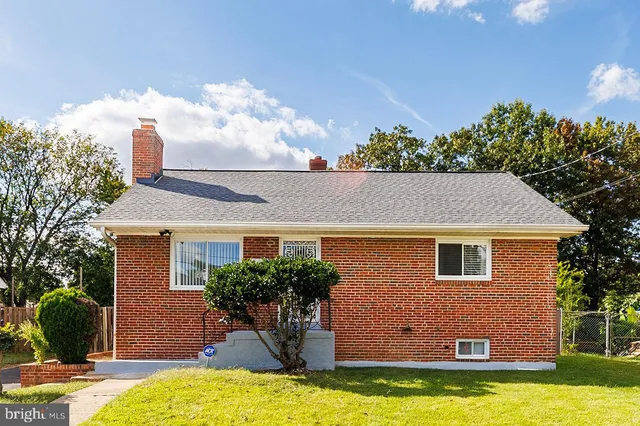 a front view of house with yard and entertaining space